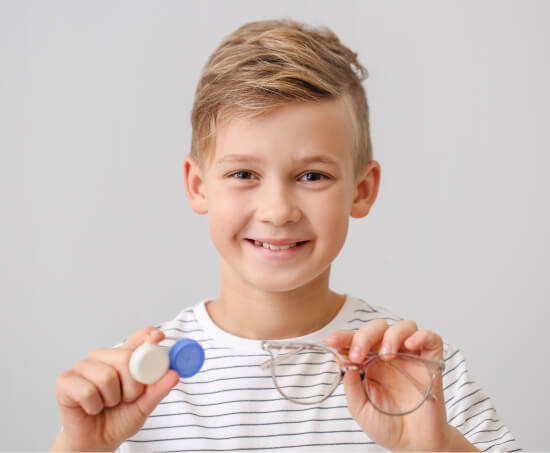 child holding contact lens at Crowder Eye Center