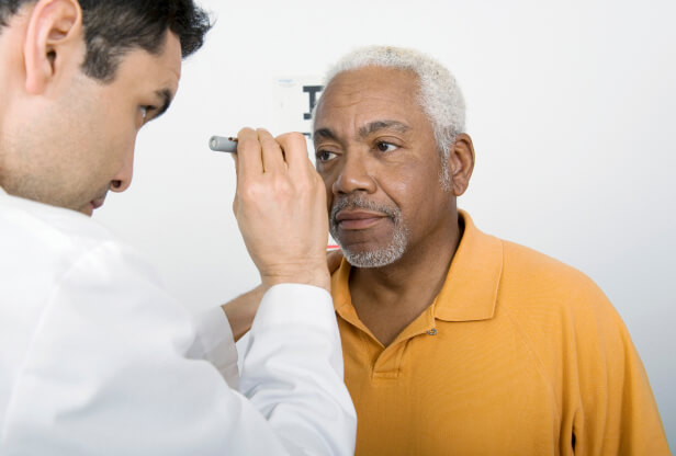 senior man taking an eye exam