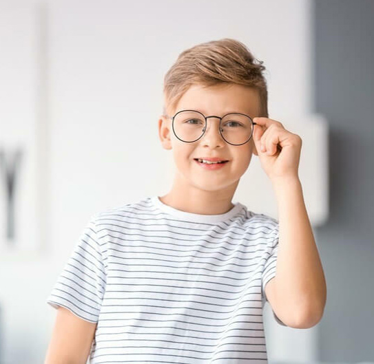 kid wearing his eyeglass happily