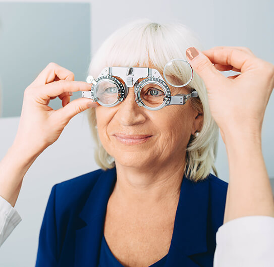 Old woman taking eye exam