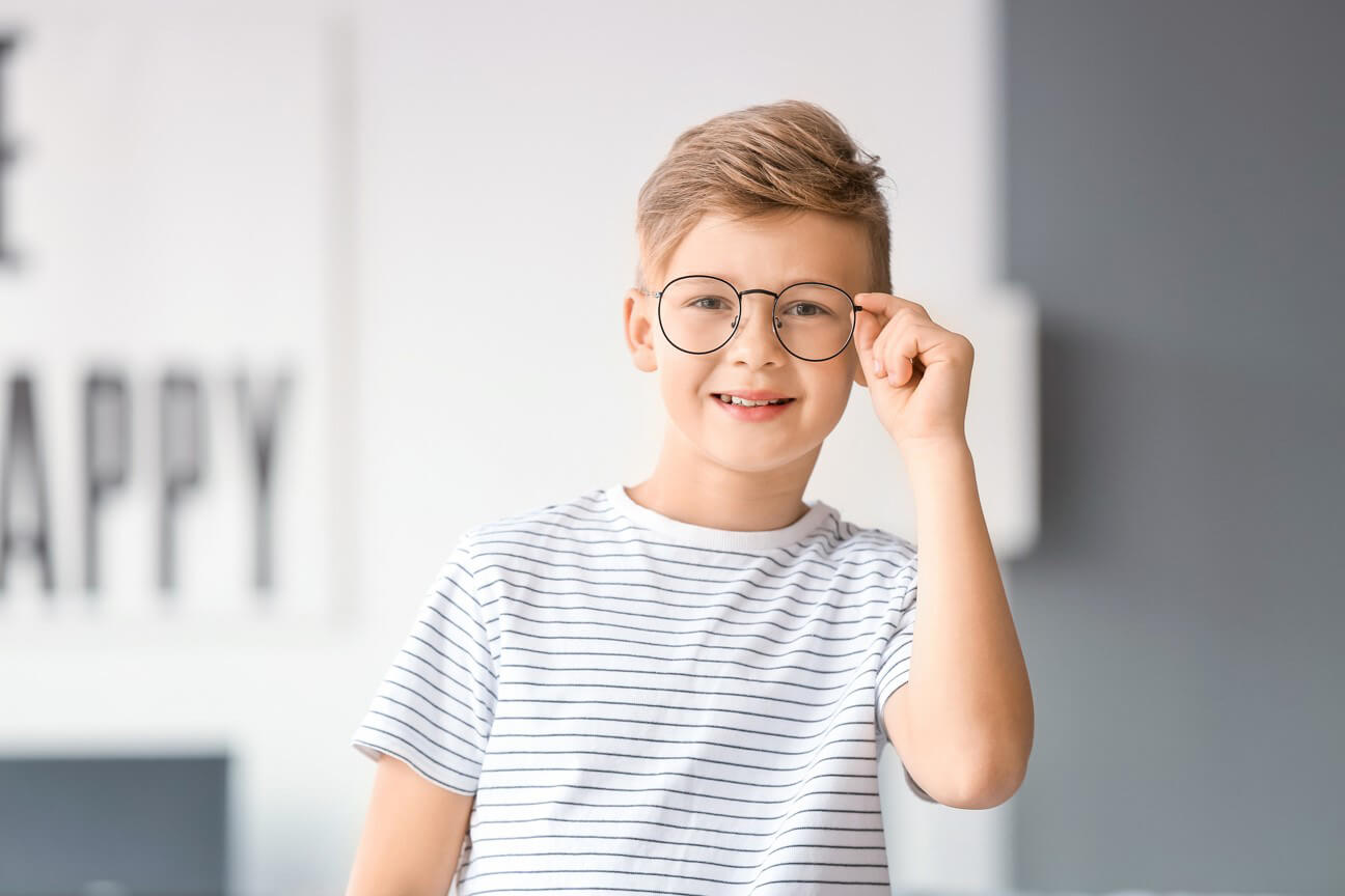 Smiling boy with glasses