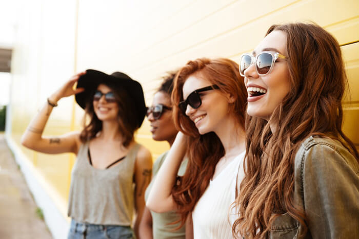 a group of girls wearing sunglasses