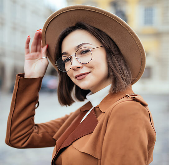 woman with glasses smiling